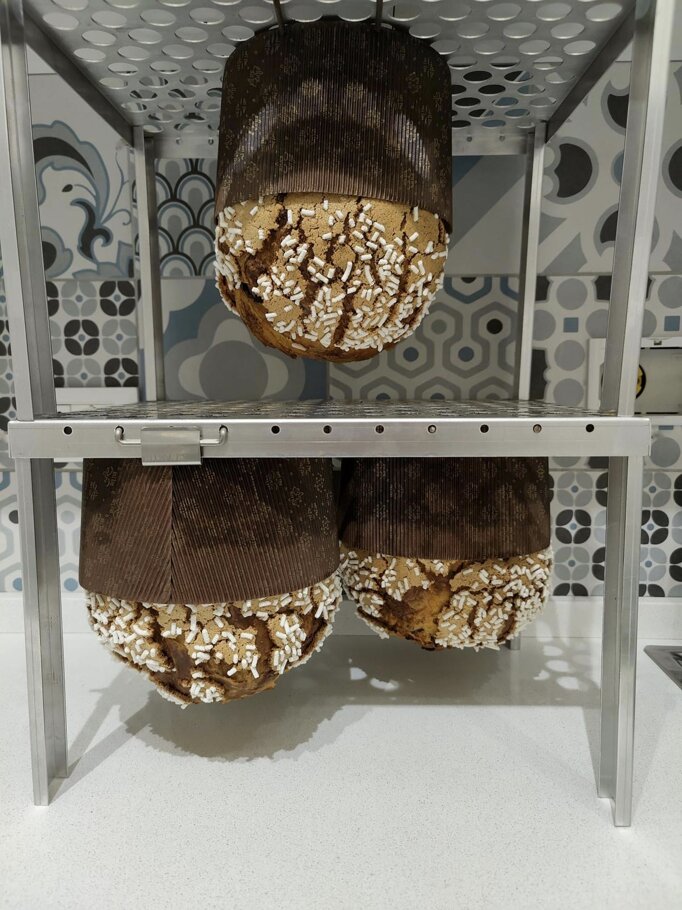 Stacked SMART Girapanettoni trays with panettone cooling upside down